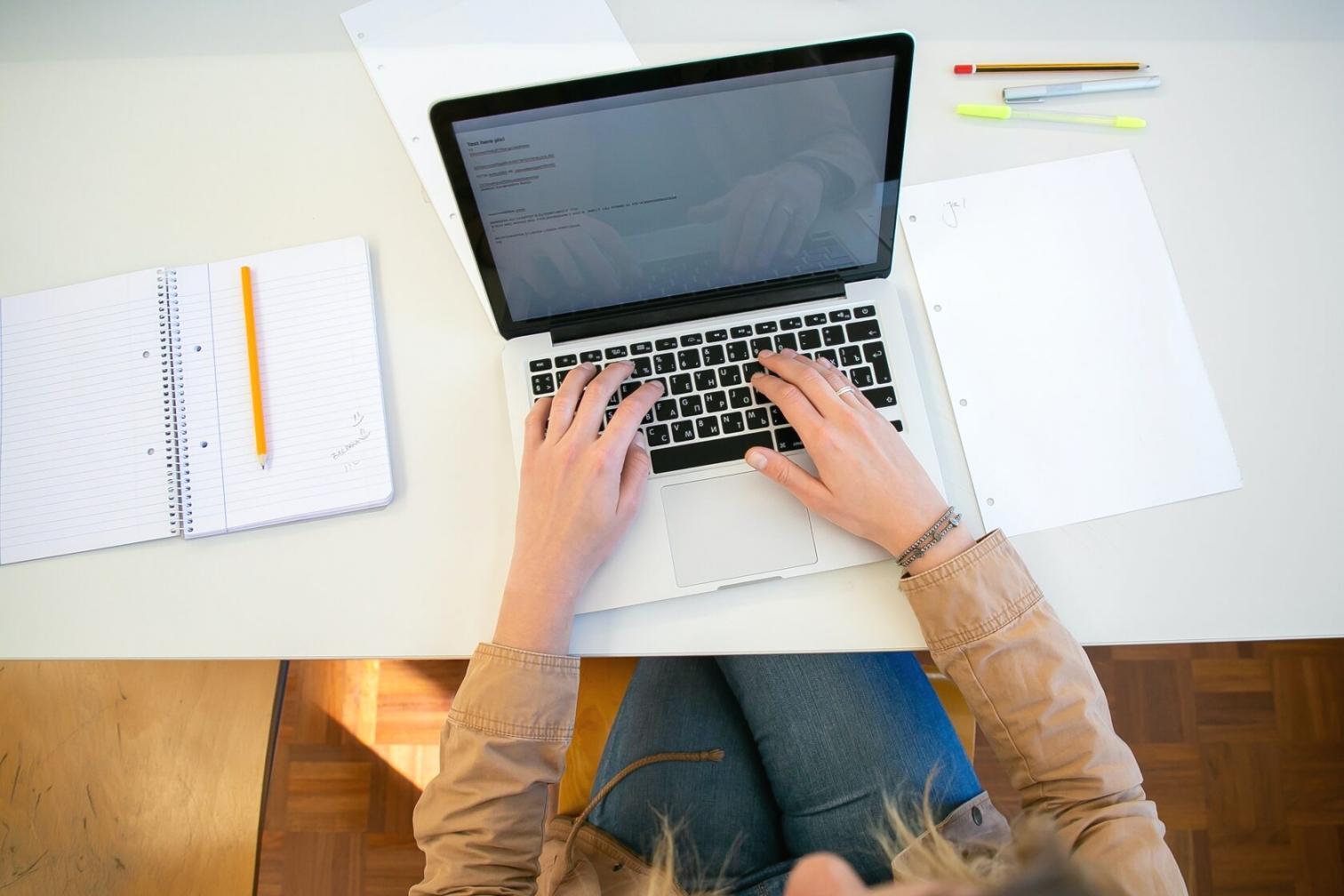 Fyfikoy instructor preparing a budget adjustment session at a desk with notes and a screen